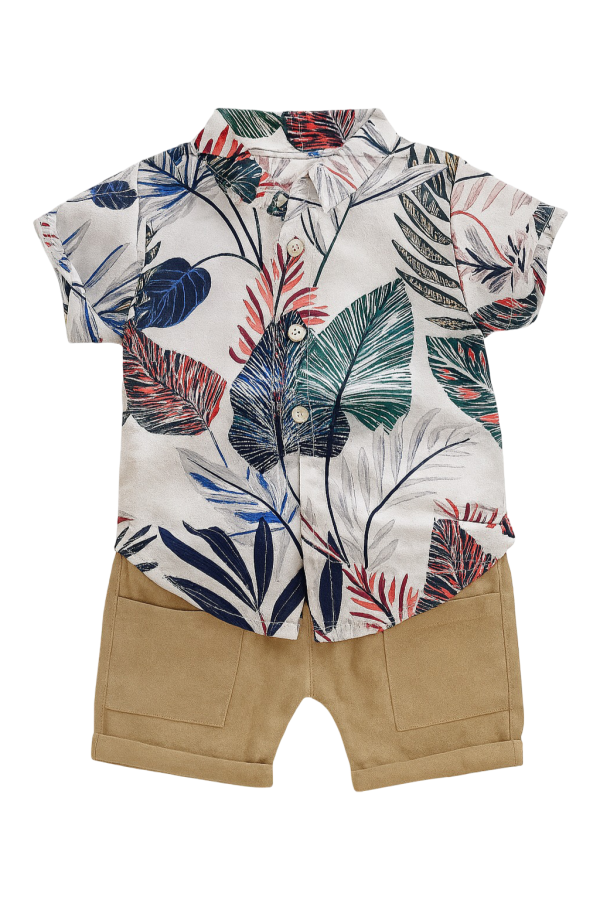 Toddler boy's summer outfit featuring a short- sleeve button-up shirt with a tropical leaf print in shades of red, blue, green, and black.