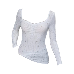 White long- sleeve top with sweetheart neckline, intricate embroidery, and eyelet details, paired with jeans for a stylish and elegant look.