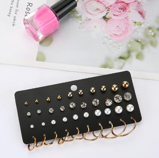 Assorted earrings, including stud and hoop styles, in a variety of sizes and designs.