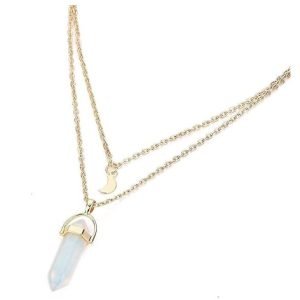 Layered gold necklace featuring a crescent moon charm and a crystal pendant, designed with delicate chains for a minimalist and elegant look.