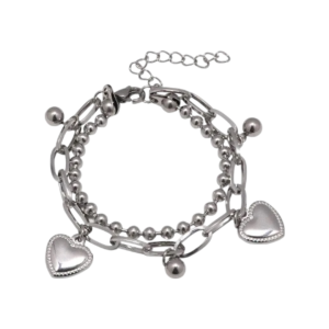 Silver bracelet featuring a mix of chain links, small beads, and two heart- shaped charms. The bracelet has a clasp and an adjustable chain for sizing. The overall aesthetic is shiny and delicate, with a playful design.