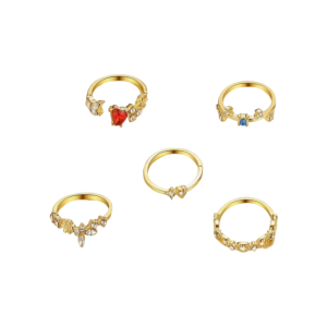 A set of gold rings with intricate designs, featuring floral patterns, clear gemstones, and accents of red and blue stones.