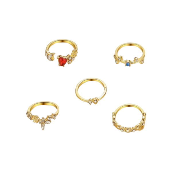 A set of gold rings with intricate designs, featuring floral patterns, clear gemstones, and accents of red and blue stones.