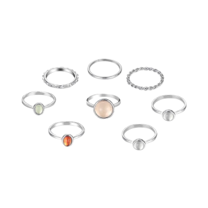 A collection of silver-tone rings featuring a variety of designs, including smooth bands, twisted details, and bezel- set stones in shades of white, orange, and green.