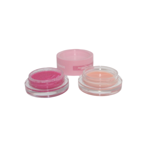 Pink lip scrub and lip balm 2-in-1 in clear round containers, designed for exfoliating and moisturizing lips.